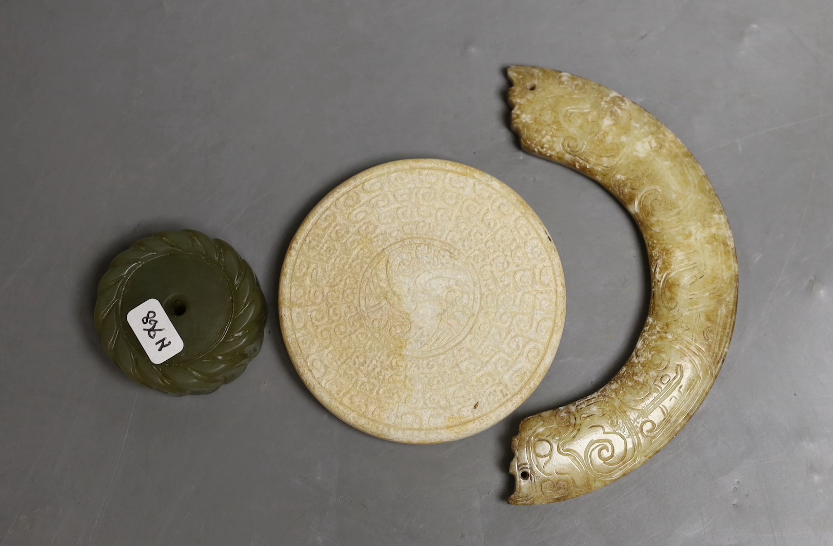 Three Chinese jade carvings - a huang, a disc and cash money